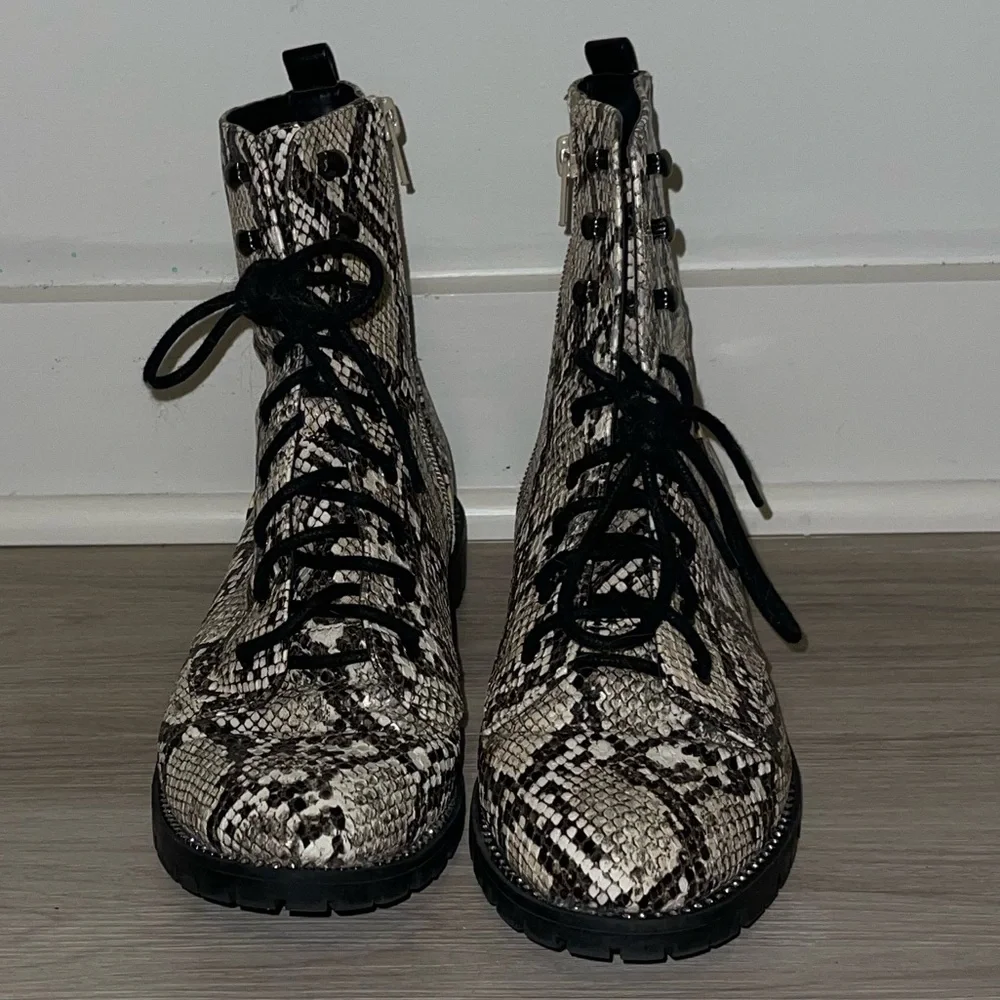 Express snakeskin combat booties. Rhinestone embellishing around sole. - Picture 4 of 10